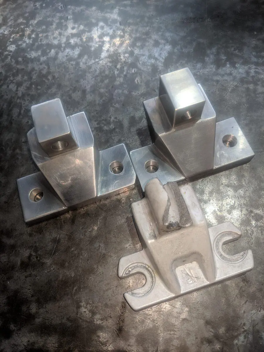 A batch of identical machined brackets