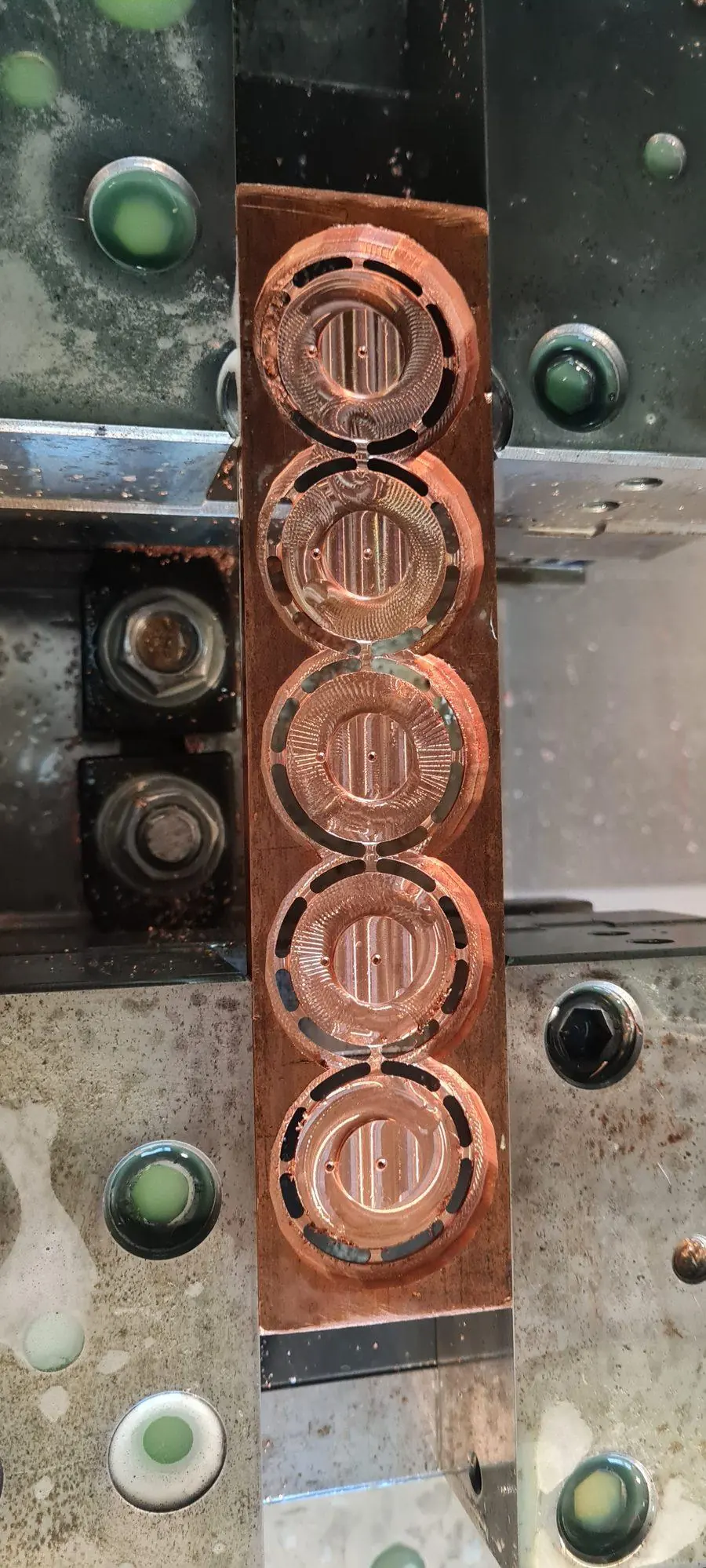 Copper die inserts held in a fixture