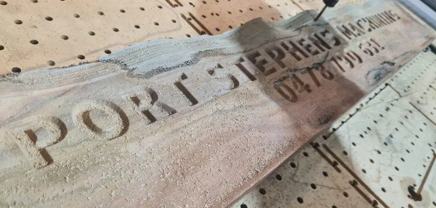 A finished carved timber sign, lettering cut on the CNC router